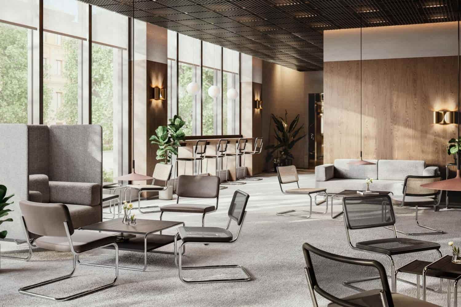 Moderner Büroraum mit ergonomischen Stühlen, großen Fenstern und Pflanzen für eine gesunde Arbeitsumgebung.