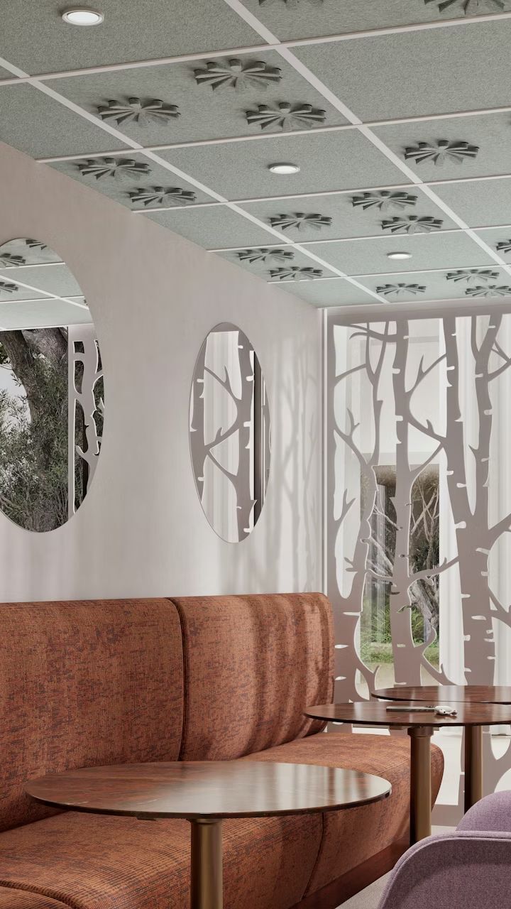 Ergonomischer Wartebereich mit Designer-Sitzbänken, runden Tischen und Wanddekoration im Waldmotiv. Perfekte Symbiose aus Komfort und Stil.