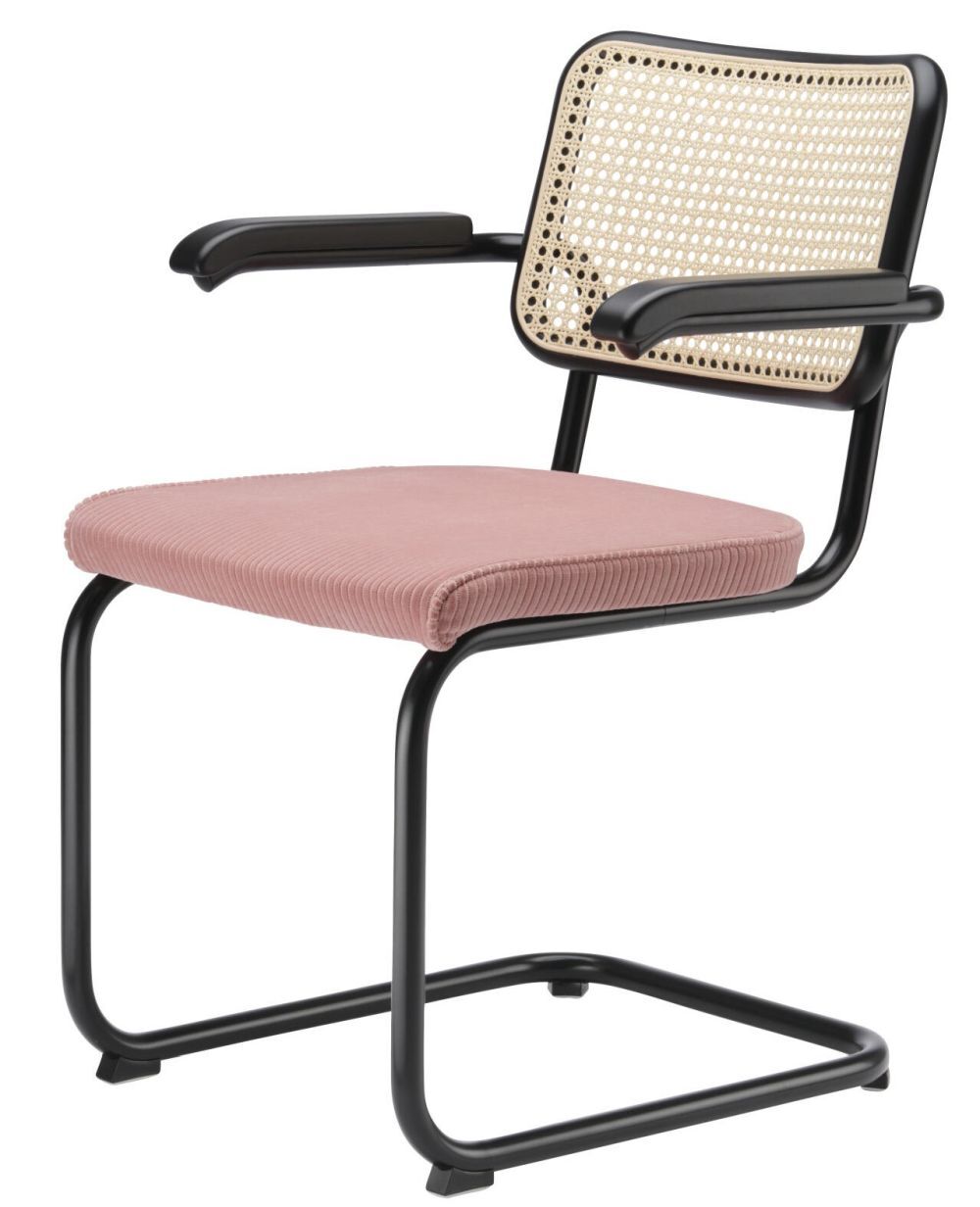 Moderner Freischwinger mit schwarzem Metallrahmen, rosa Sitzpolster und geflochtener Rückenlehne für ergonomisches Sitzen.