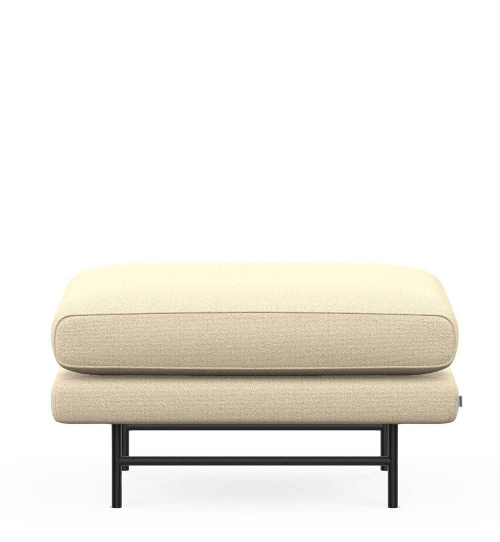 Beige Ottomane mit schwarzem Metallgestell, ideal für ergonomische und stilvolle Inneneinrichtung.